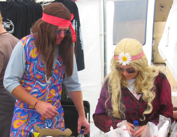 A couple of hippies browing the trading stalls
