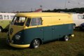 Yellow and green splitty in camping area