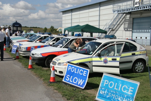 Line-up of old police cars